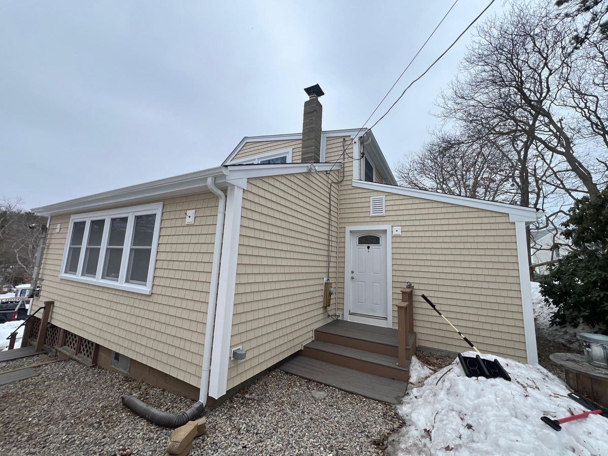 New cedar shake siding on a Plymouth home