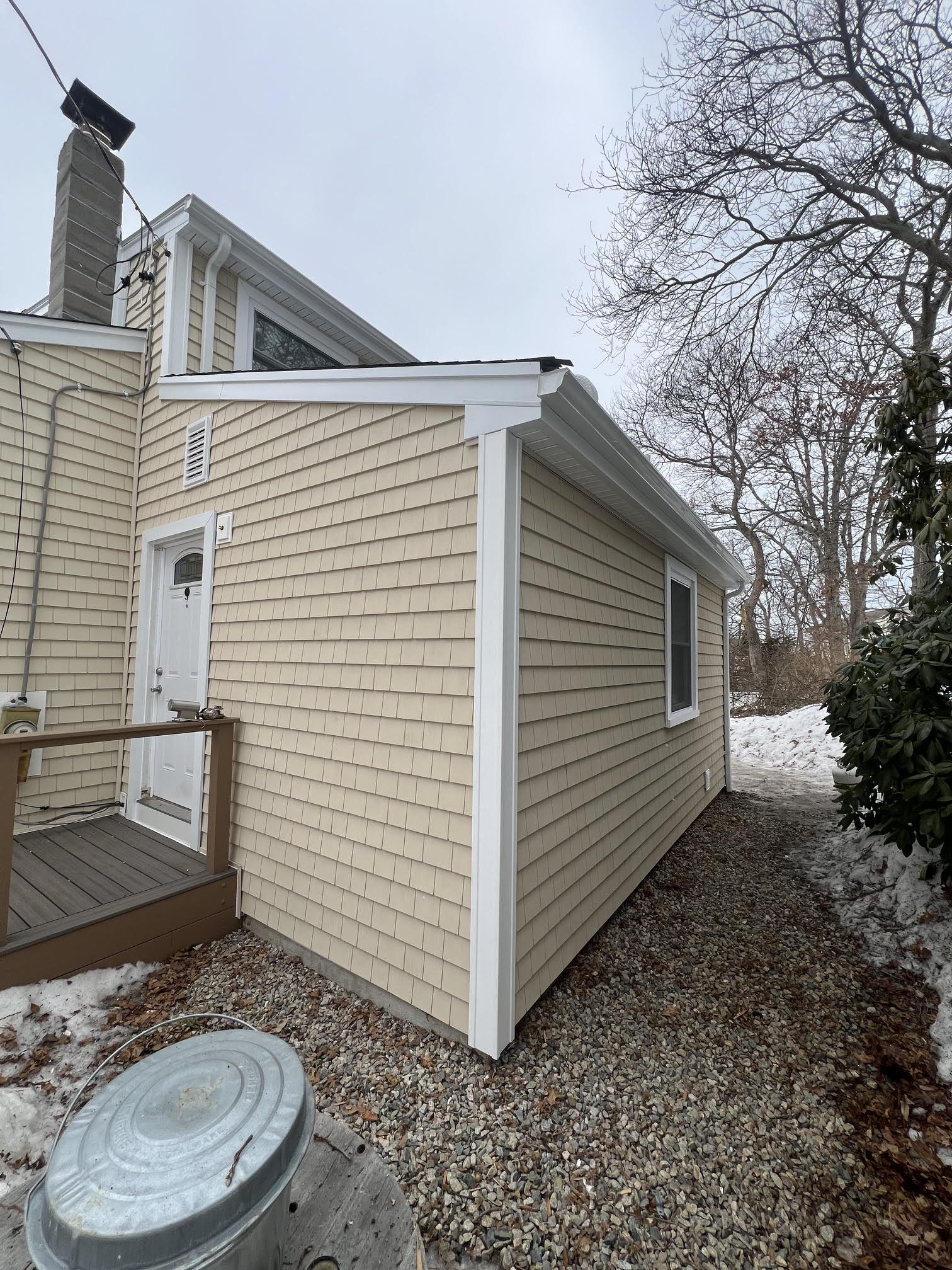 New shake siding on the side of a Plymouth home