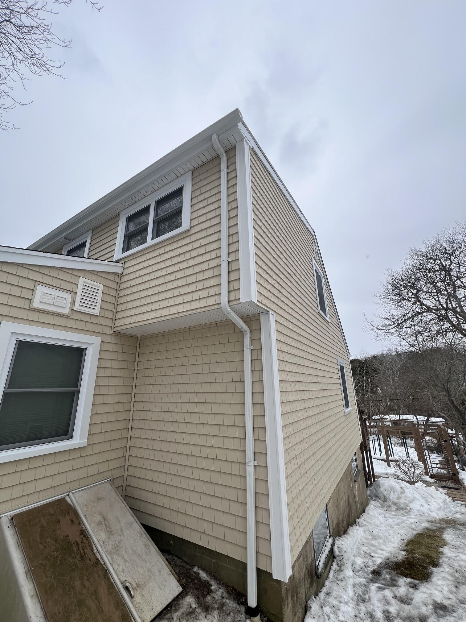 Detailed shake siding installation on a Plymouth home